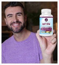 Happy customer reviewing Gut Vita supplement for digestion and comfort